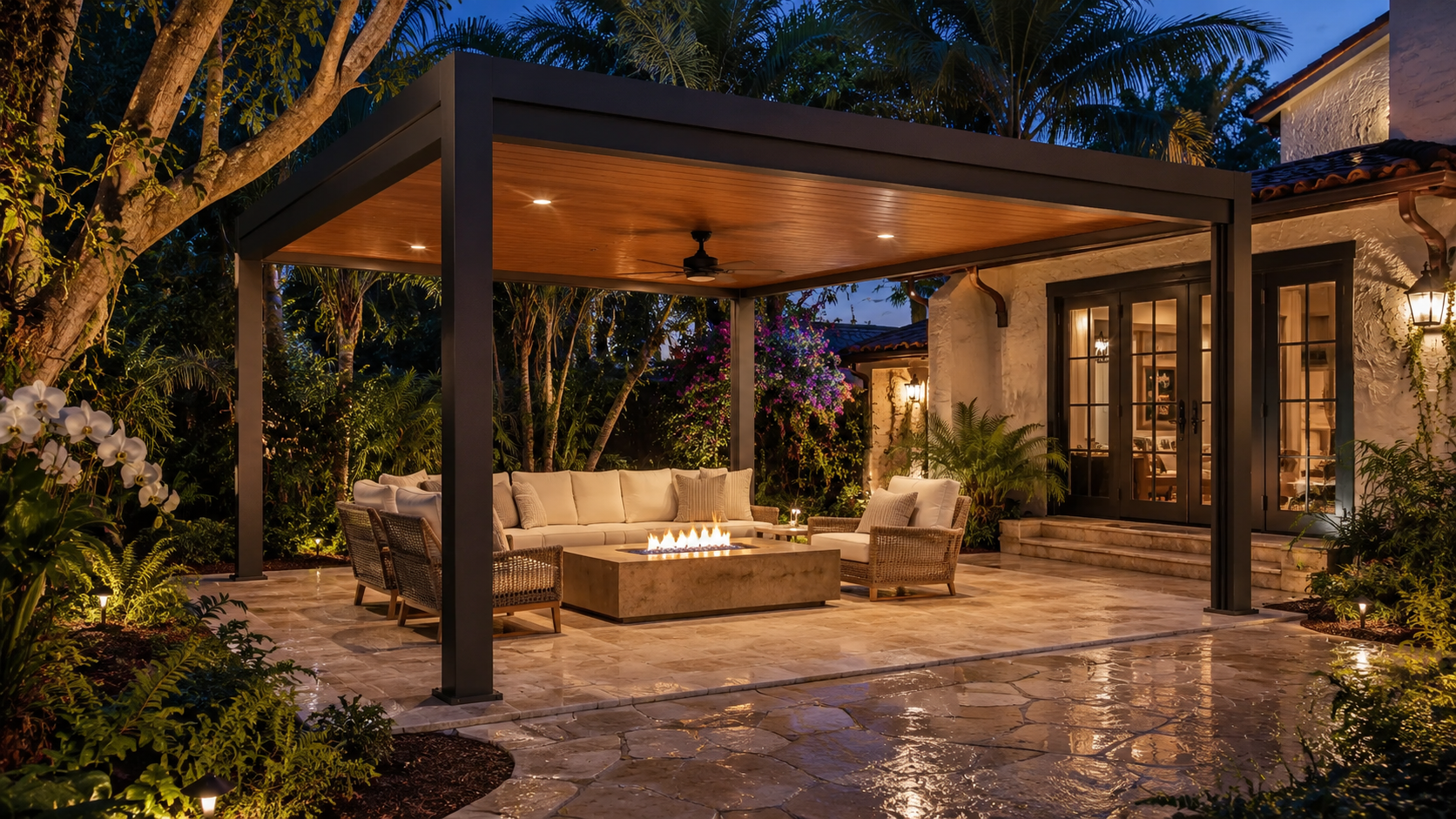 Freestanding dark-bronze frame with a wood-grain insulated ceiling, lounge and fire table.
